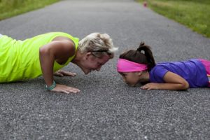 mom and daughter exercising