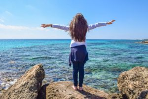 girl at water's edge